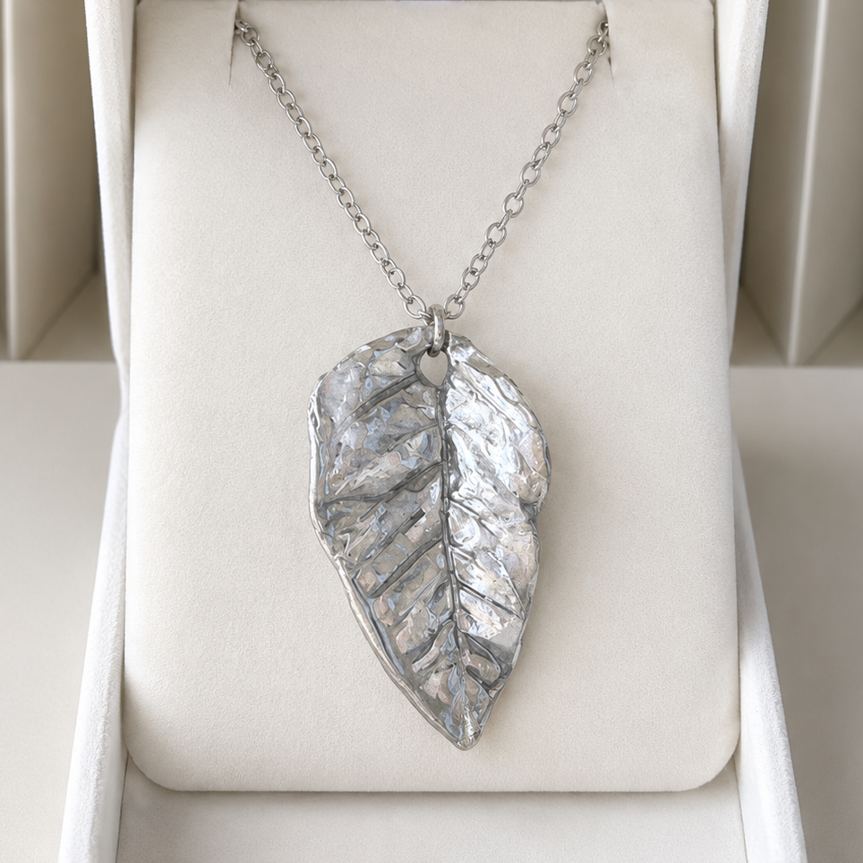 Silver leaf pendant necklace in a white jewelry box